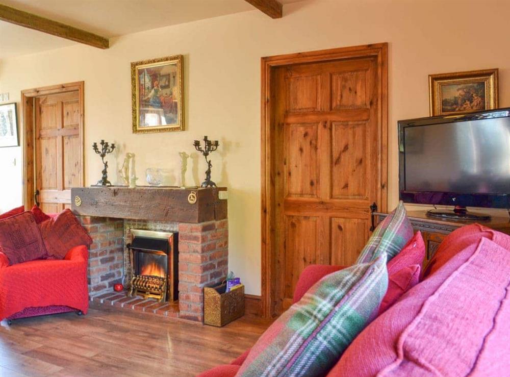 Wood-floored living/dining room at Acorn Barn in Laytham, near York, North Yorkshire