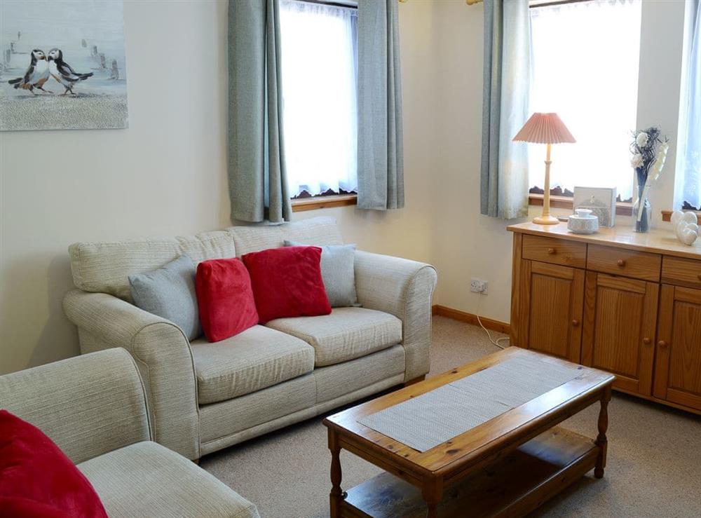 Attractive good-sized living room (photo 2) at Acorn Cottage in Conon Bridge, Highlands, Ross-Shire