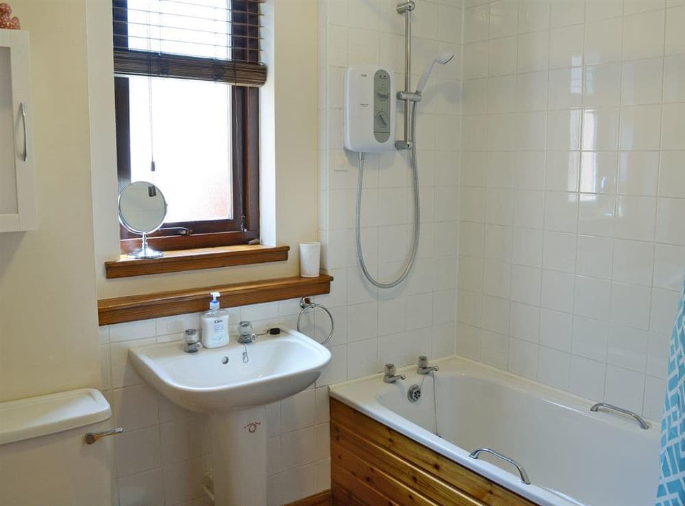 Bathroom with shower over bath at Acorn Cottage in Conon Bridge, Highlands, Ross-Shire