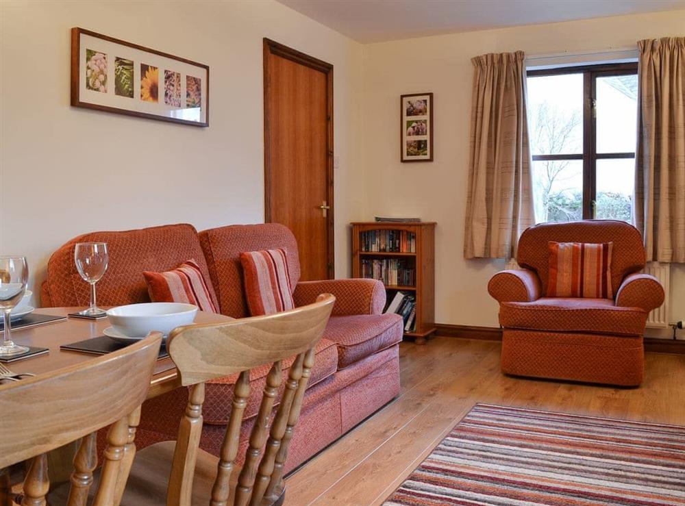 Living room and dining area at Acorn Cottage in Keswick, Cumbria
