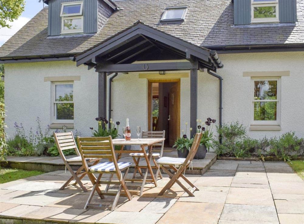 Paved patio with outdoor furniture at Acorn Cottage in Kippen, near Stirling, Stirlingshire., Great Britain