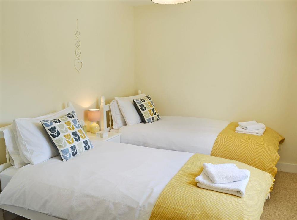 Comfortable twin bedroom at Acorn Cottage in North Perrott, near Crewkerne, Somerset