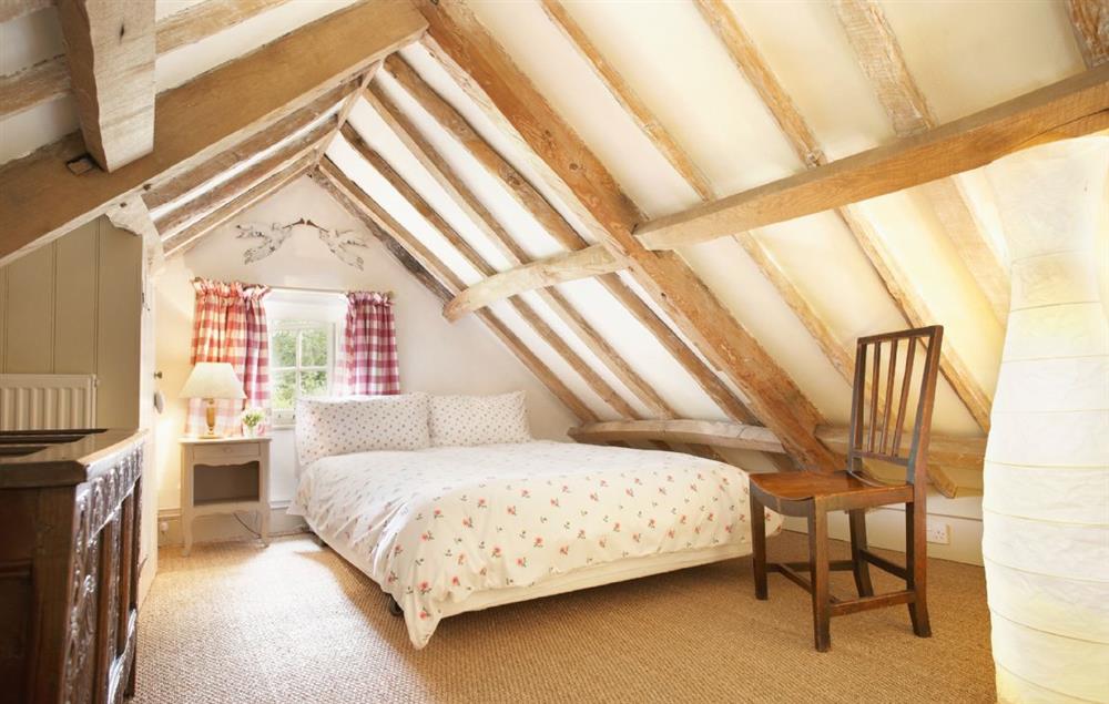 galleried double bedroom with 4’6 bed, ptiched ceilings with restricted height at Acorn Cottage, Oulton