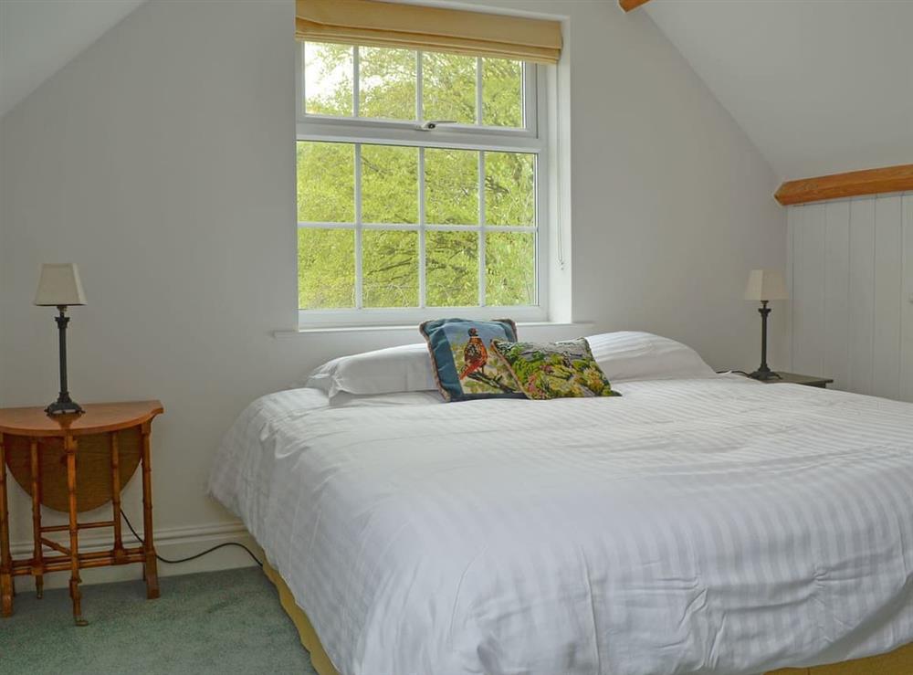 Lovely double bedroom with wooden beams at Acorn Cottage in Todenham, near Moreton-in-Marsh, Gloucestershire