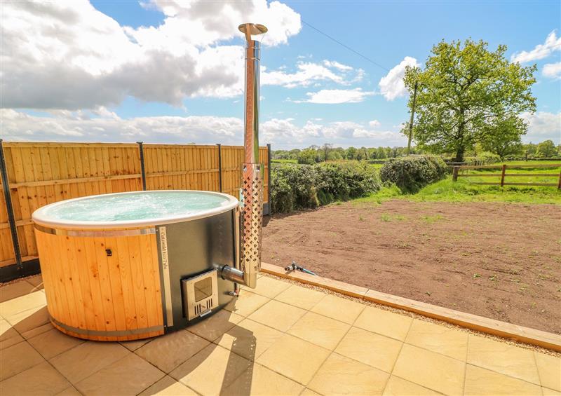 Spend some time in the hot tub at Acorn Lodge, Milwich near Sandon