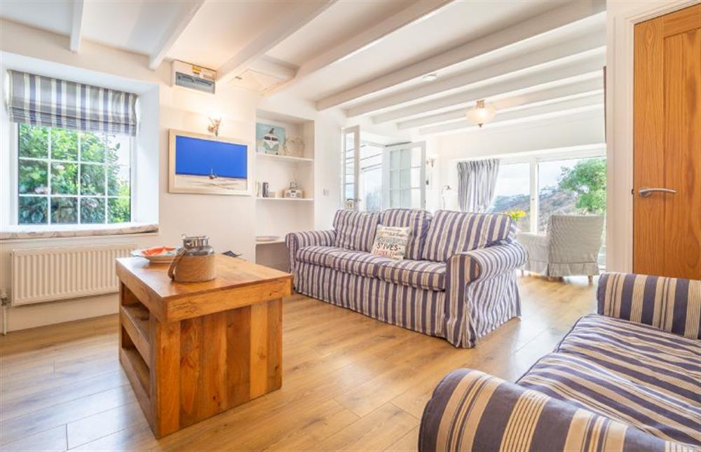 Sitting room with a king-size sofa bed at Adanac, Sennen Cove