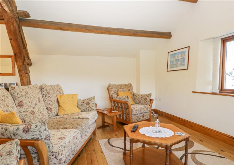 Relax in the living area at Adas Cottage, Kirkby-In-Furness