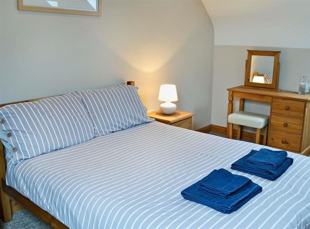 Charming double bedroom with kingsize bed at Aden Barn in Allonby, near Silloth, Cumbria, England