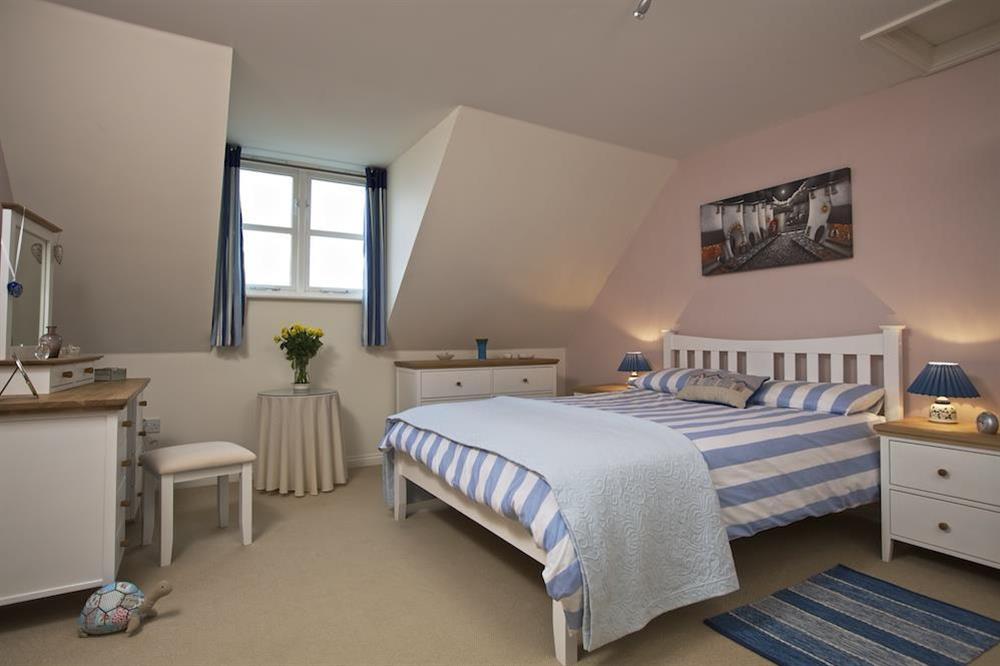 En suite master bedroom with King size bed at Aft Cottage in , Kingswear
