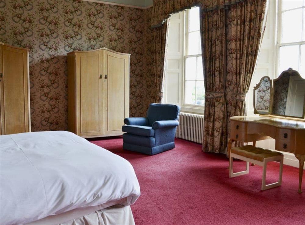 Very large master double bedroom with (5ft bed), and sitting area with TV (photo 2) at Akeld Manor House in Akeld, Wooler, Northumberland., Great Britain