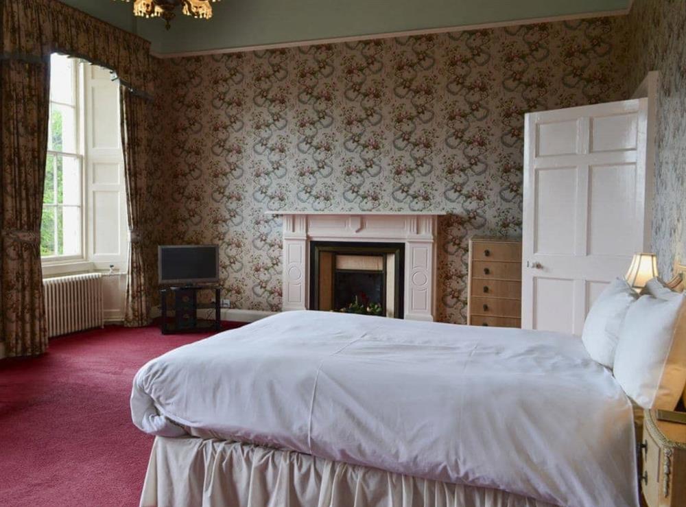 Very large master double bedroom with (5ft bed), and sitting area with TV at Akeld Manor House in Akeld, Wooler, Northumberland., Great Britain
