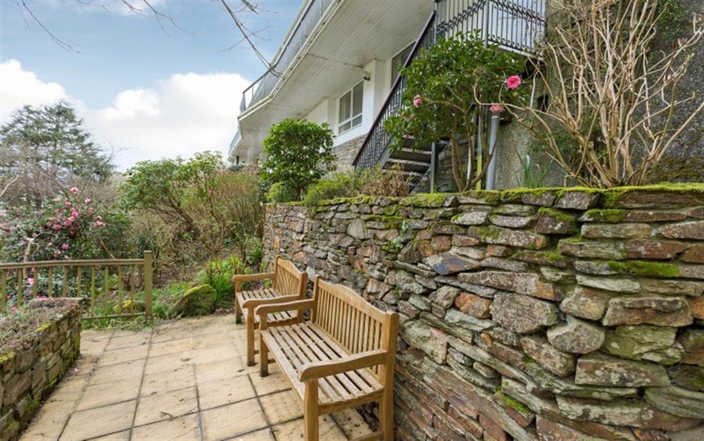One of the seating areas in the tiered garden at Alarra in Polperro