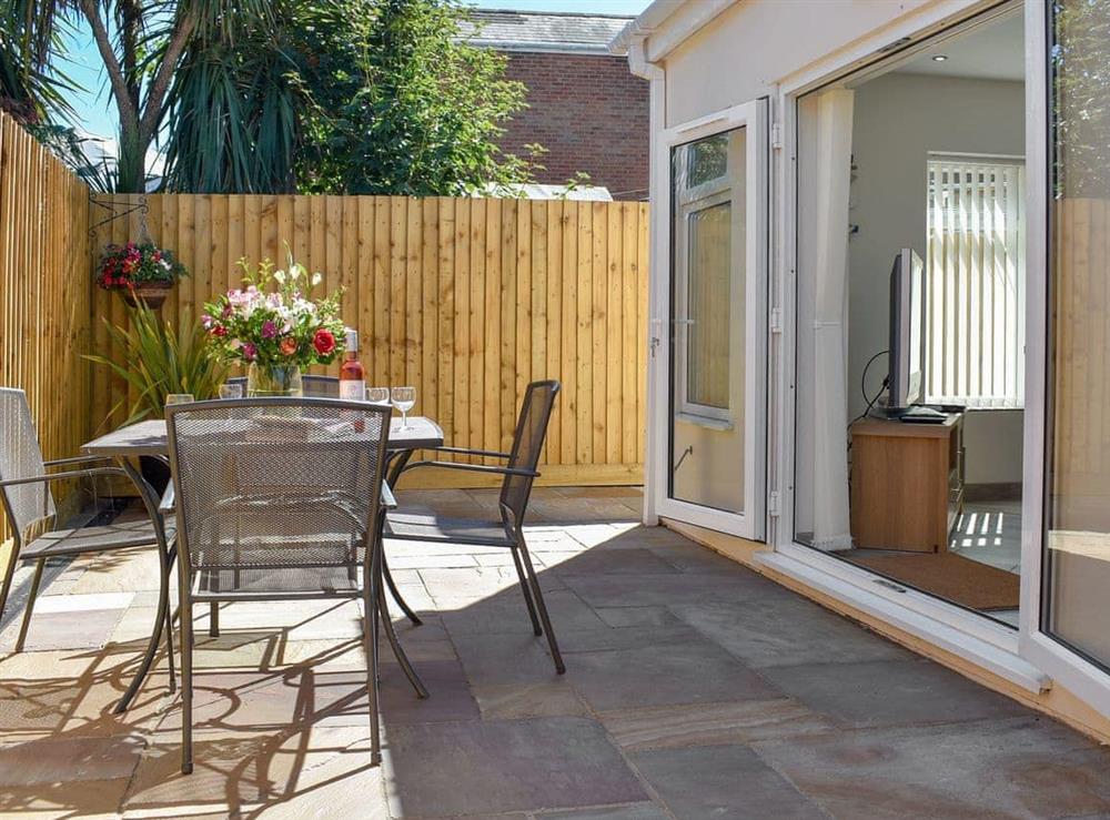 Patio with sitting out furniture at Albert Apartment in Poole, Dorset