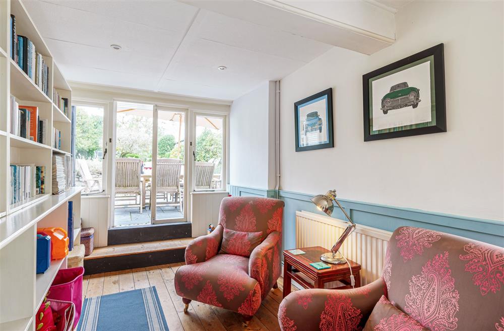 A cosy reading area in the family snug at Albury House, Charmouth
