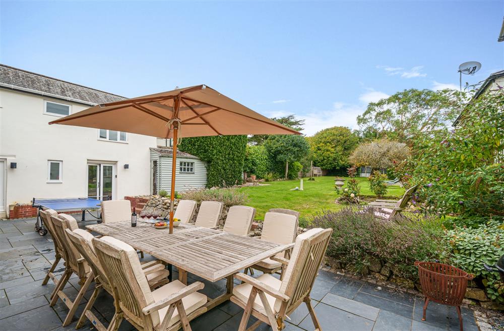 Relax and unwind in this spacious garden at Albury House, Charmouth