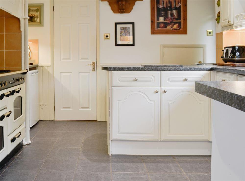 Kitchen with slate floor at Alderley House in Bourton-on-the-Water, Gloucestershire