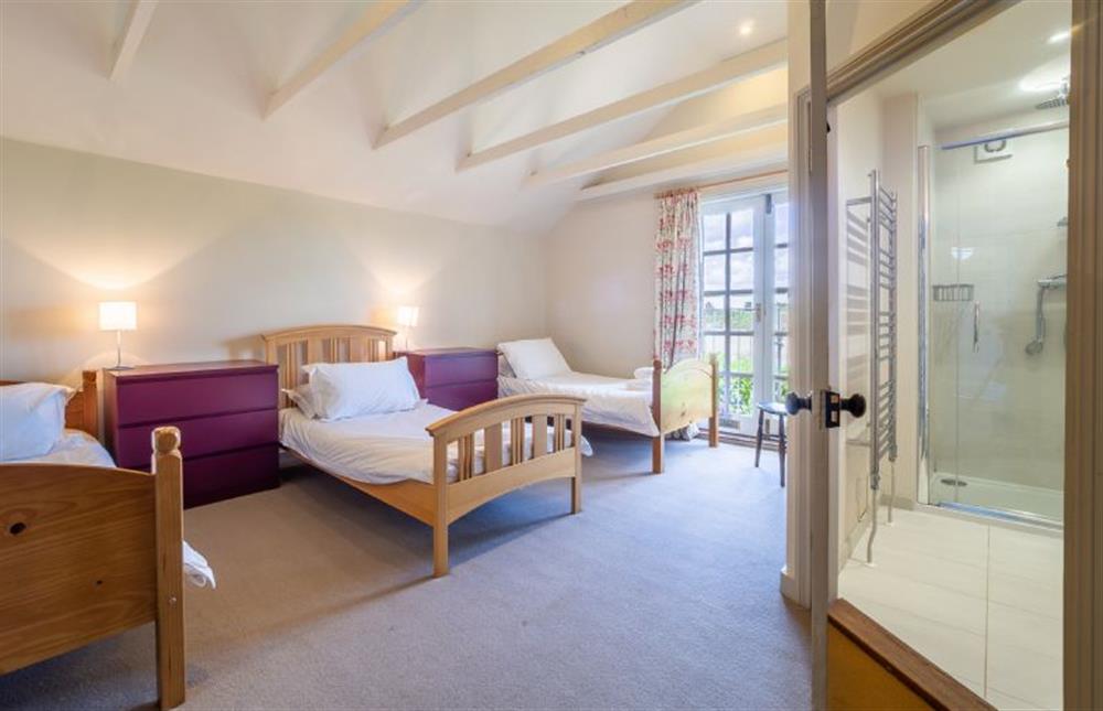 Bedroom three with three 3’ single beds at Alexander House, Thorpeness