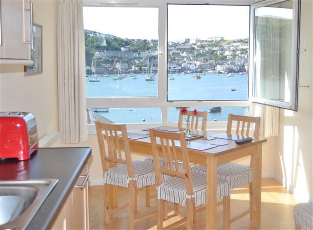 Modern Kitchen with wooden dining table and chairs at Alexandras View in Fowey, Cornwall