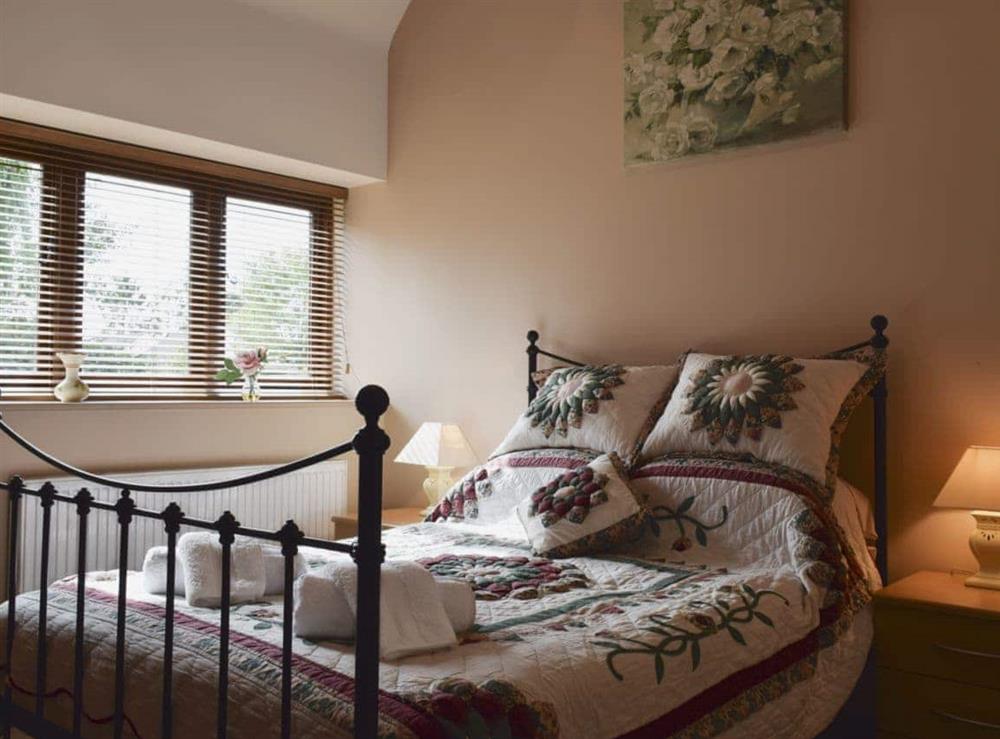 Beamed double bedroom with en-suite shower room at Alfie’s Barn in Ambrosden, Oxfordshire., Great Britain