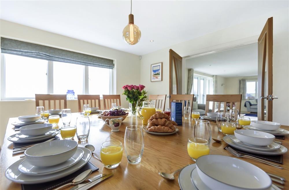 All Views, Dorset: A generous dining table with seating for twelve guests at All Views, Bridport