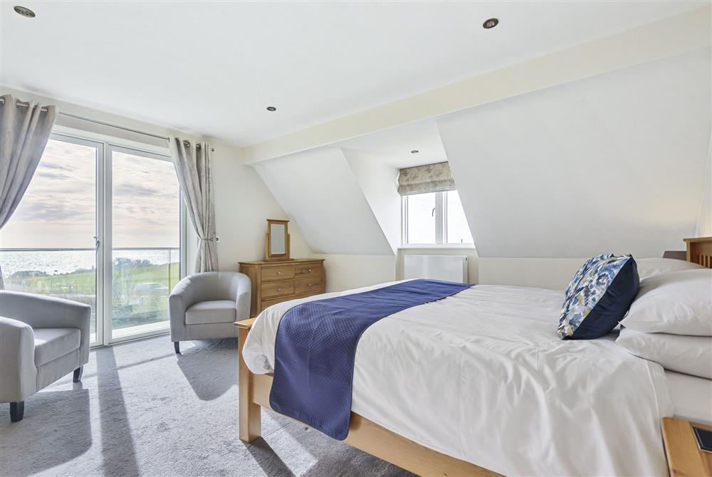 All Views, Dorset: Bedroom three, a super-king size bedroom with doors to the private balcony with coastal views