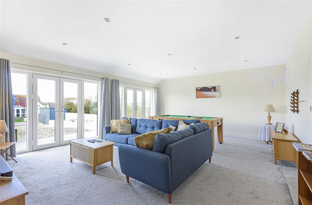 All Views, Dorset: Comfortable seating area in the family games room for watching television at All Views, Bridport