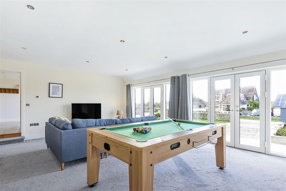 All Views, Dorset: The family games room with pool table, table tennis and television at All Views, Bridport