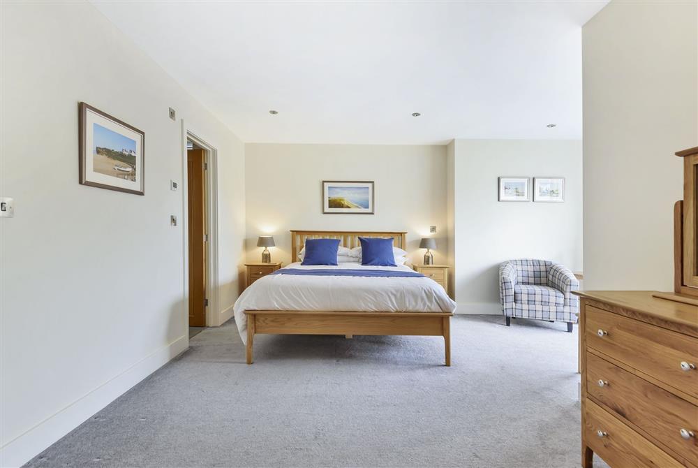Ground floor: The spacious king-size bedroom with en-suite shower room at All Views, Bridport