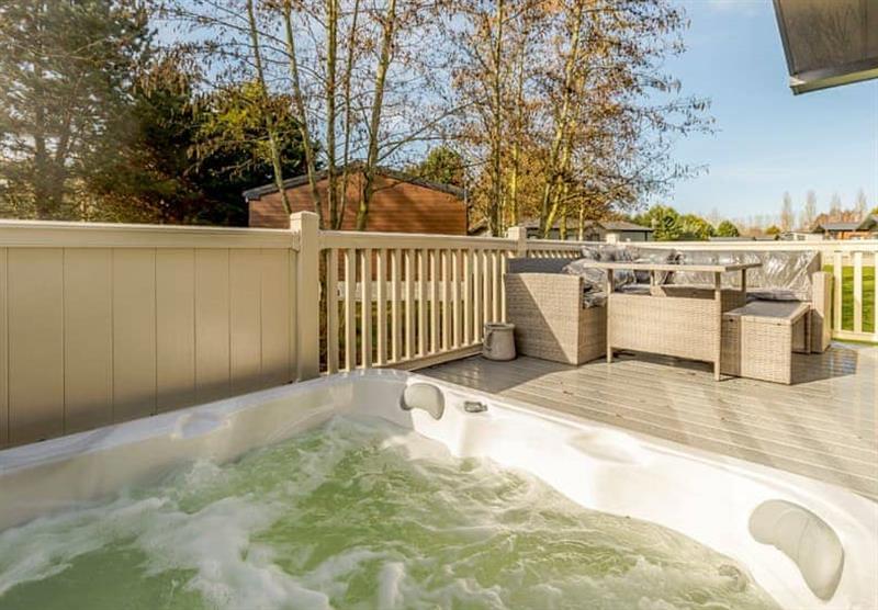 Hot tub and decking in the Waterside Lodge VIP at Allerthorpe Golf and Country Park in Allerthorpe, Yorkshire