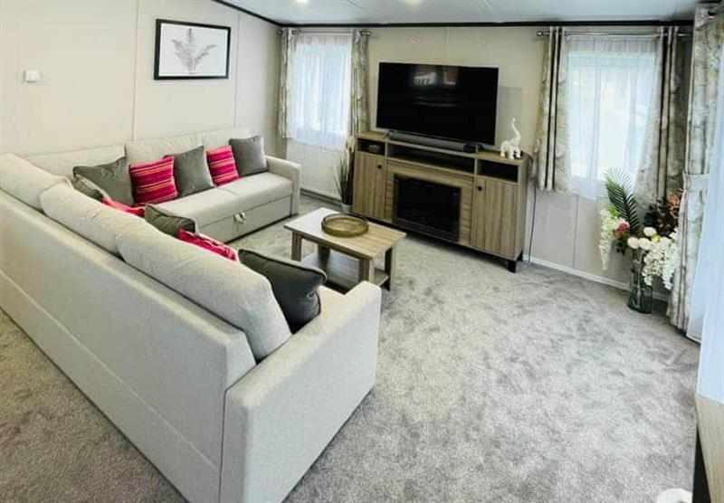 Living room in the Waterside Lodge VIP at Allerthorpe Golf and Country Park in Allerthorpe, Yorkshire