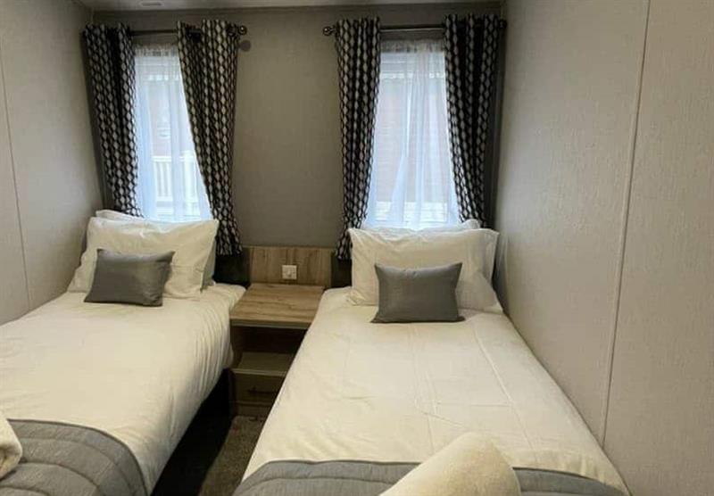 Twin bedroom in the Waterside Lodge VIP at Allerthorpe Golf and Country Park in Allerthorpe, Yorkshire