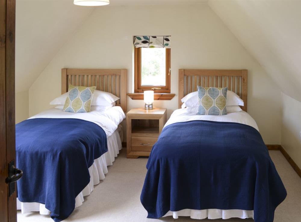 Peaceful bedroom with twin beds at Allt Beag in Achintraid, near Lochcarron, Highlands, Ross-Shire