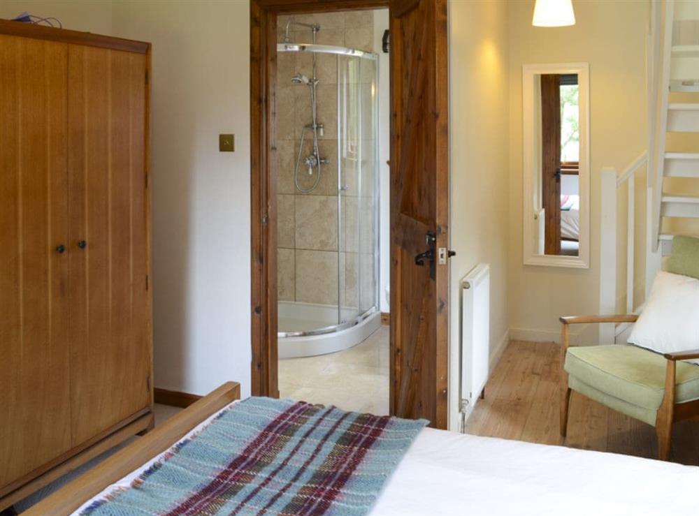 Relaxing bedroom with king-size bed and en-suite at Allt Beag in Achintraid, near Lochcarron, Highlands, Ross-Shire