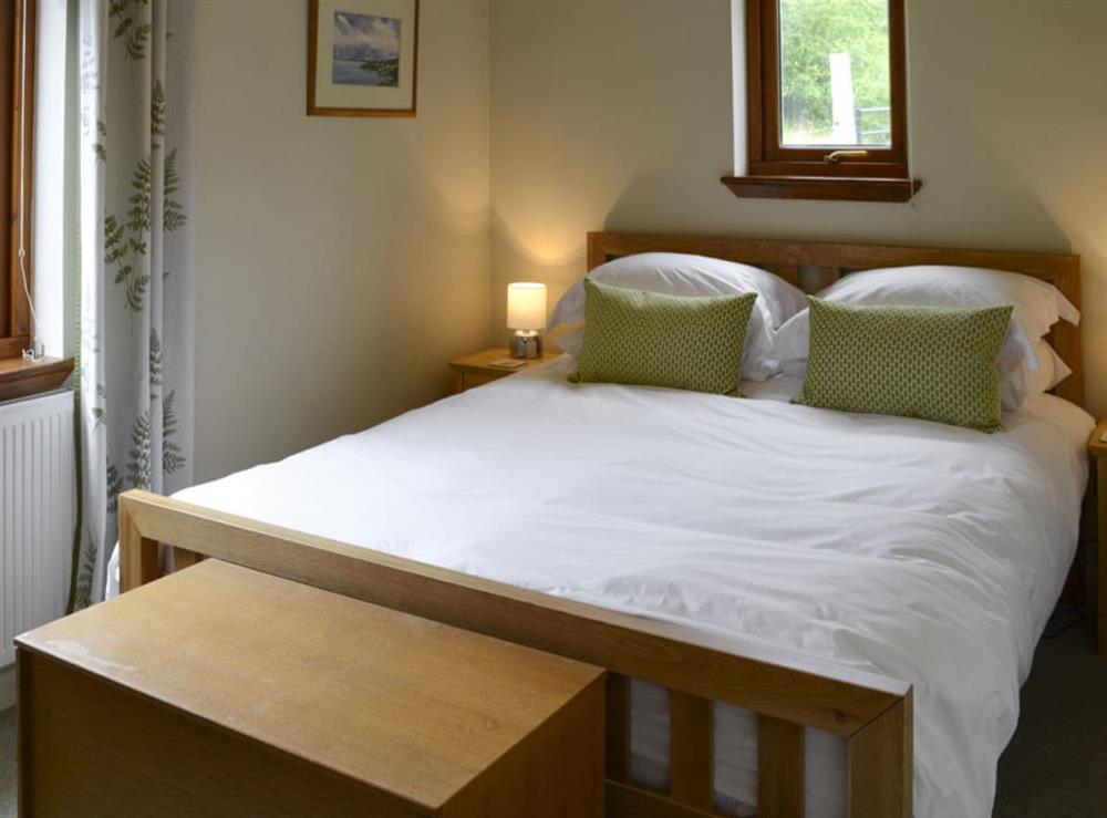 Tranquil bedroom with king-size bed at Allt Beag in Achintraid, near Lochcarron, Highlands, Ross-Shire