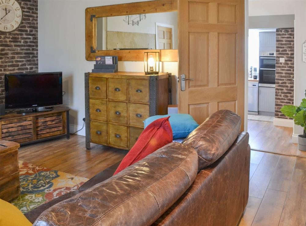 Wooden-floored living room through to the kitchen/diner at Alnwick Cottage in Alnwick, Northumberland