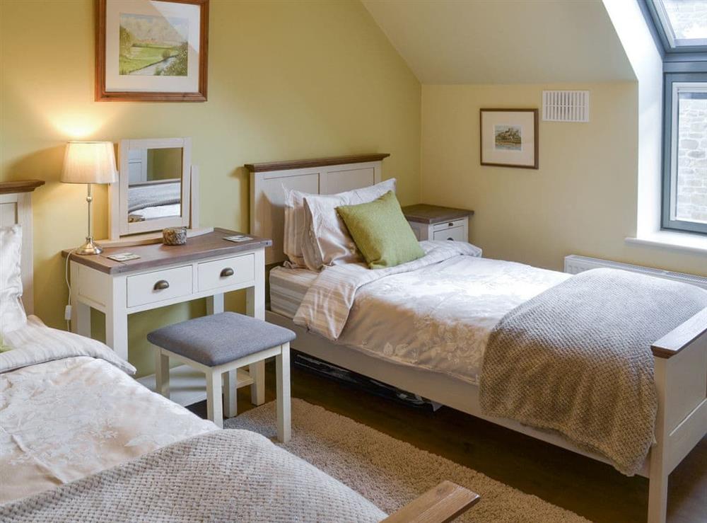 Comfortable twin bedroom at Alnwick Old Brewery Apartment in Alnwick, Northumberland