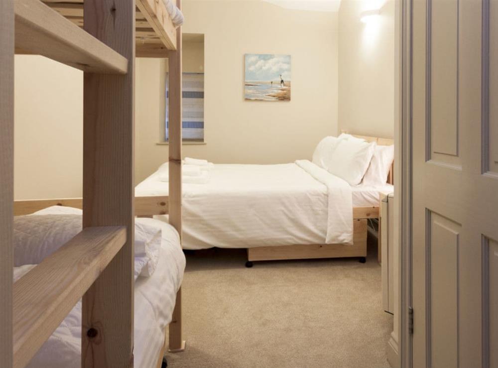 Spacious bedroom with kingsize bed and small bunk bed (photo 3) at Aloft in Salcombe, Devon