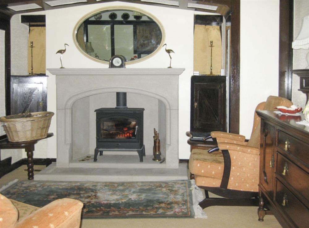 Characterful living room with wood burner at Alondra Cottage in Blacko, Lancashire