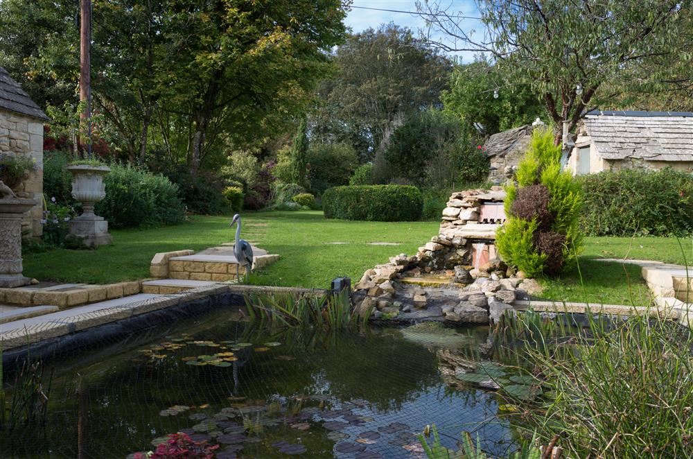 Covered pond in the garden at Alpaca Lodge, Burford