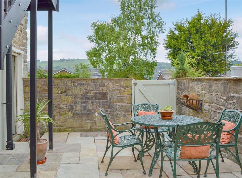 Spacious patio with sitting out area (photo 2) at Alphin Apartment in Mossley, Lancashire