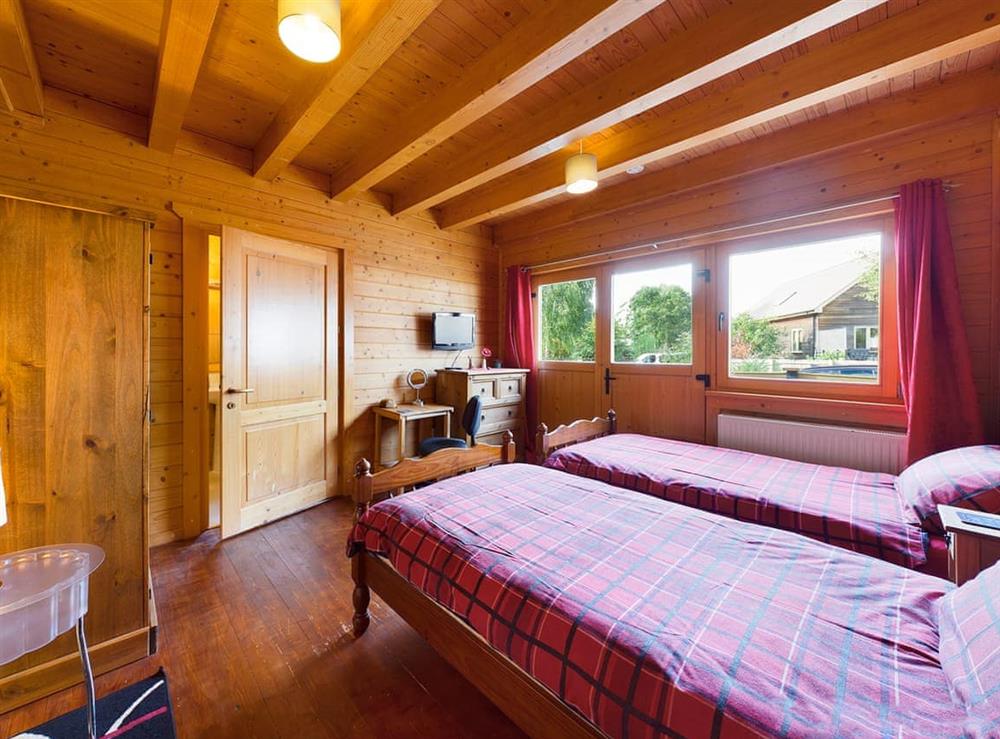 Twin bedroom at Alpine Lodge in Pentney, Norfolk