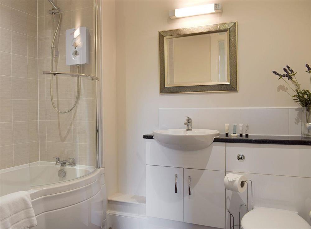 Family bathroom with shower over bath at Am Tighndhuin in Killin, Perthshire