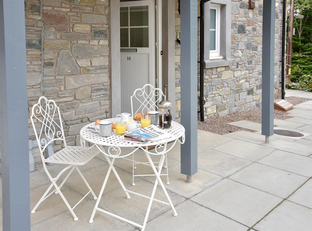 Paved patio with outdoor furniture at Am Tighndhuin in Killin, Perthshire