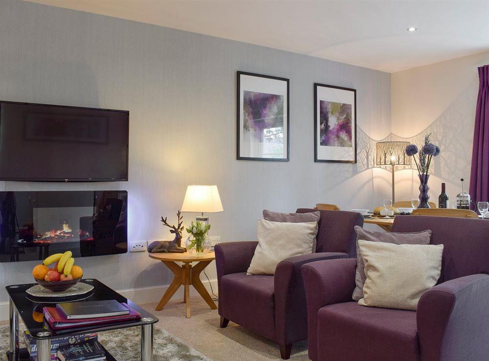 Welcoming living and dining room at Am Tighndhuin in Killin, Perthshire
