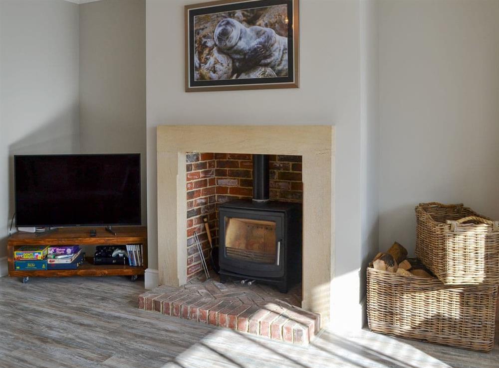 Charming living room with wood burner at Amber Waves in Seahouses, near Alnwick, Northumberland