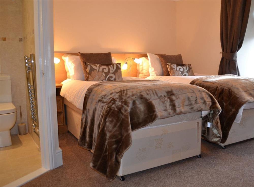 Super kingsize bedroom made up as a twin at Amberleigh House in Windermere, Cumbria