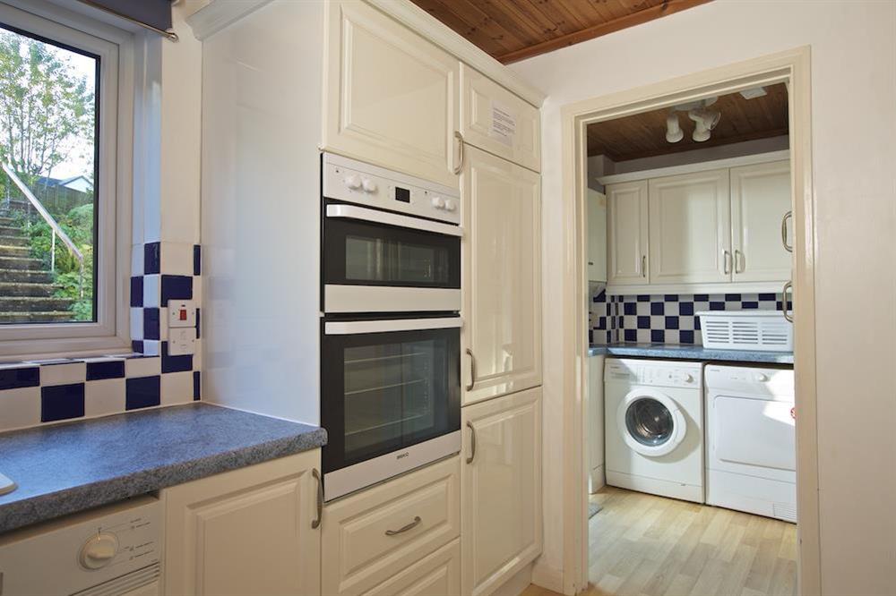 Kitchen opens into the utility room at Amberley in , Dartmouth