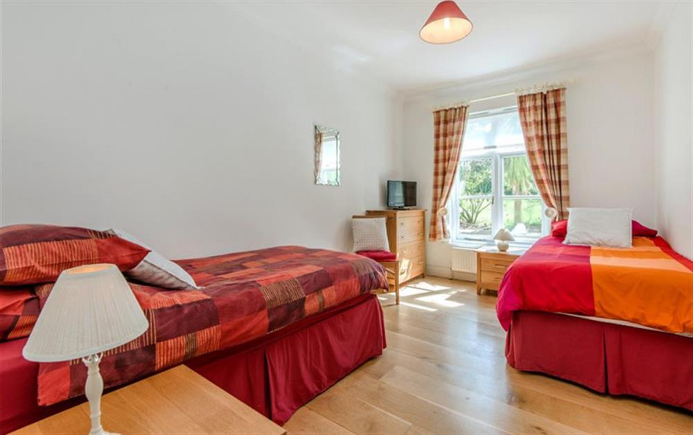 Bedroom 2 with twin beds and TV at Amberley in Stokenham