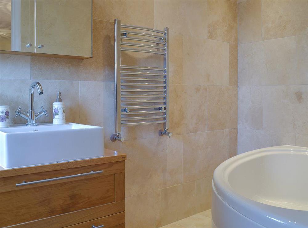 Charming tiled en-suite with heated towel rail at Amelyah Cottage in Winscombe, near Weston-super-Mare, Avon