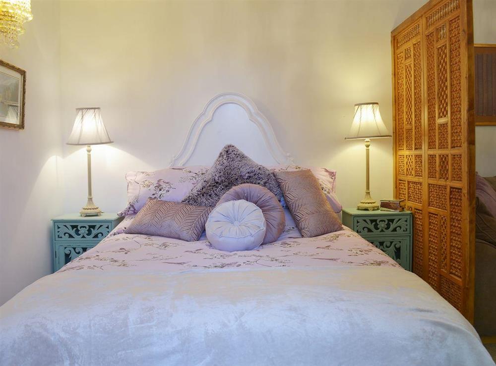 Romantic and inviting double bed at Amelyah Cottage in Winscombe, near Weston-super-Mare, Avon
